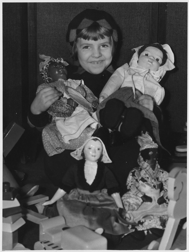 Young girl with dolls